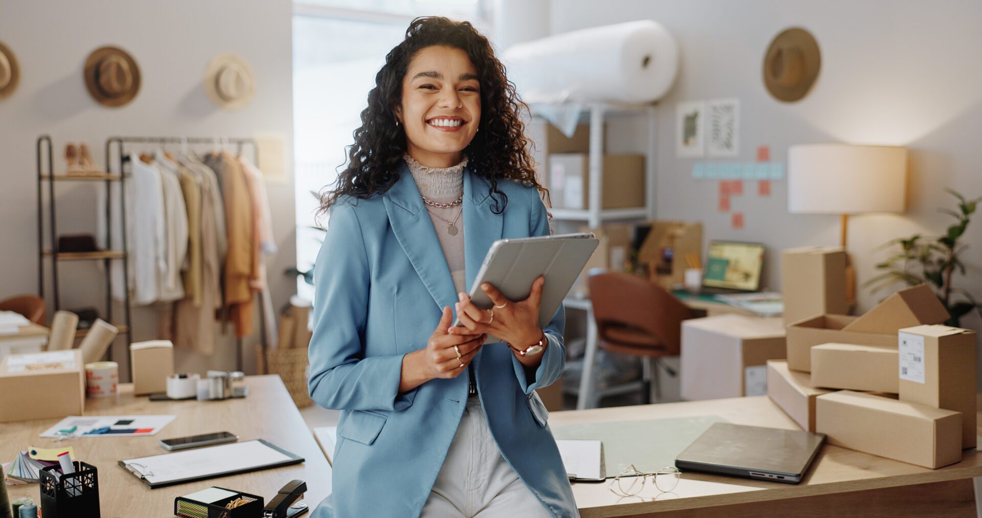 Happy woman, portrait and fashion designer with tablet in logistics or small business management at boutique. Female person or entrepreneur smile with technology in supply chain at retail store.
